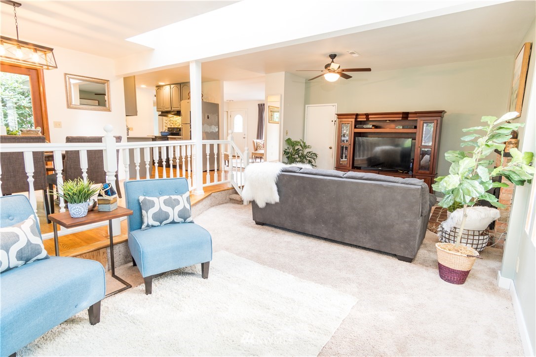 14634 Southeast 140th Street Renton, WA 98059 - Photo 14 of 35 a living room with furniture and a fireplace