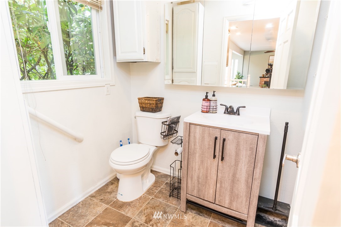 14634 Southeast 140th Street Renton, WA 98059 - Photo 9 of 35 a bathroom with a sink toilet and a window