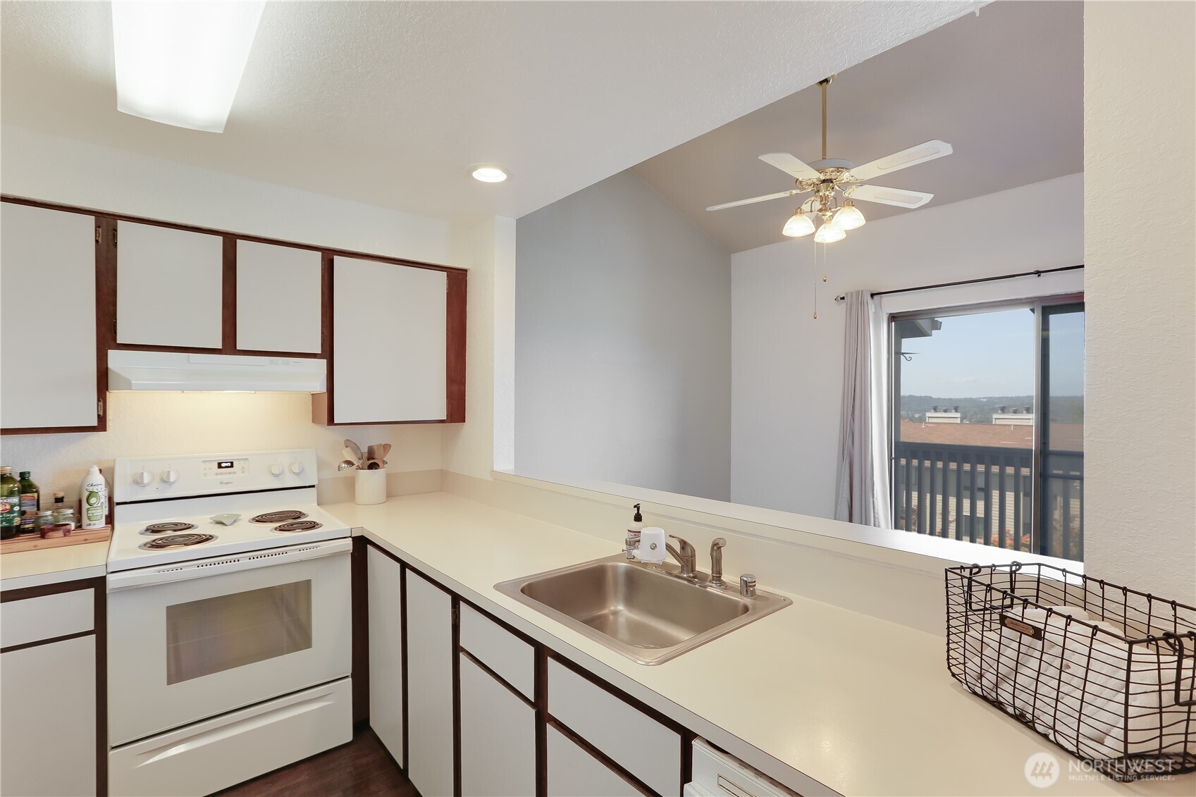 1315 South Puget Drive, Unit C36 Renton, WA 98055 - Photo 14 of 25 a bathroom with a sink a vanity and a mirror