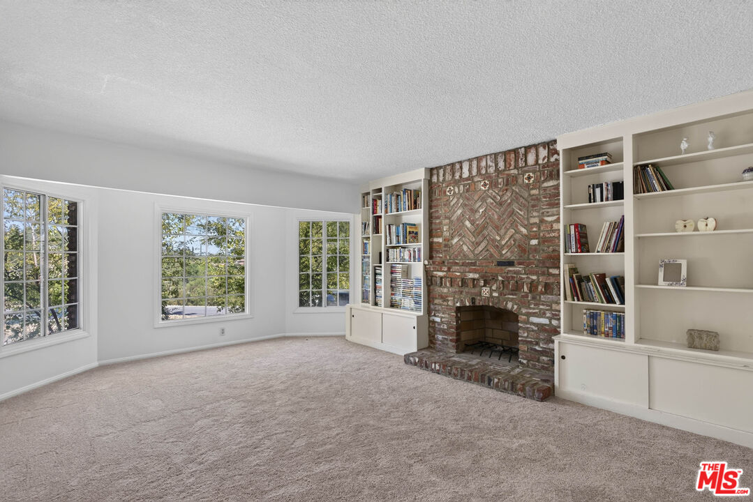 24962 Eldorado Meadow Road Hidden Hills, CA 91302 - Photo 7 of 19 an empty room with furniture and large window