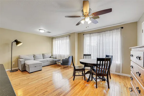 a room with a fireplace and wooden floor