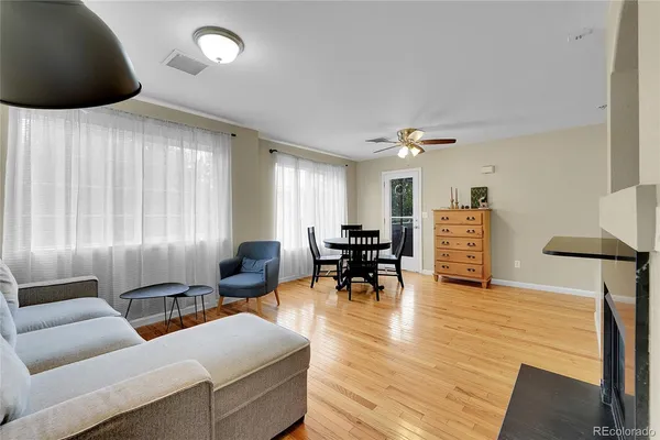 a room with a fireplace and wooden floor