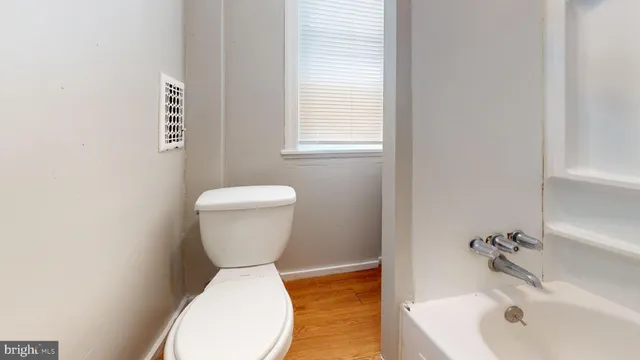 a bathroom with a sink a toilet and a bathtub