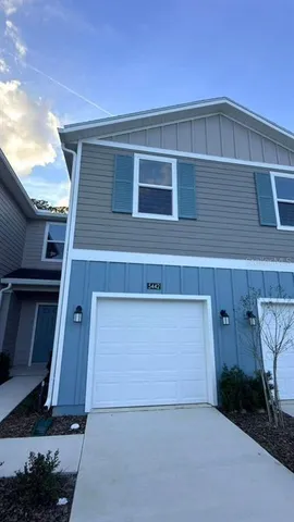 a front view of a house with garage