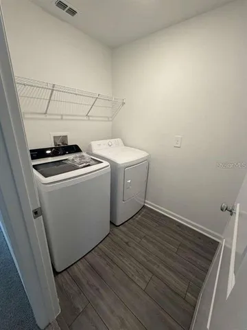a utility room with dryer and washer