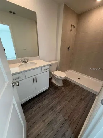 a bathroom with a sink and mirror