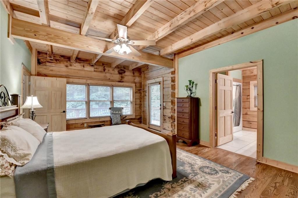 82 Walnut Grove Lane Tiger, GA 30576 - Photo 30 of 88 a bed sitting in a spacious bedroom next to a window