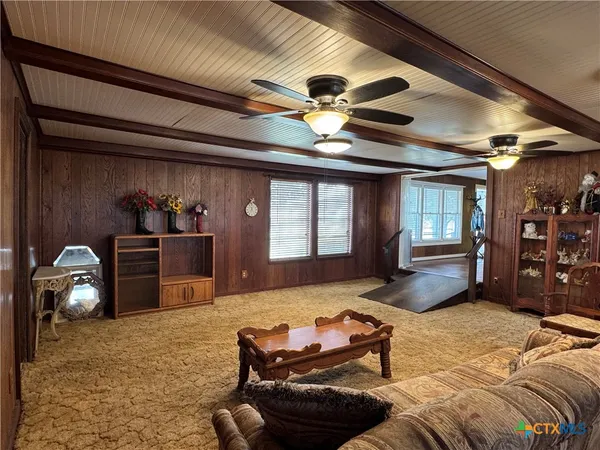a bedroom with furniture and window