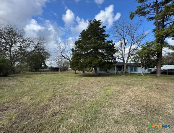 a view of outdoor space with deck and yard