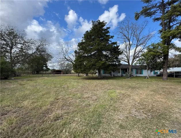 a view of outdoor space with deck and yard