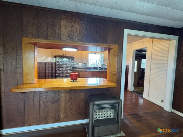 a view of a room that has a bed and a window