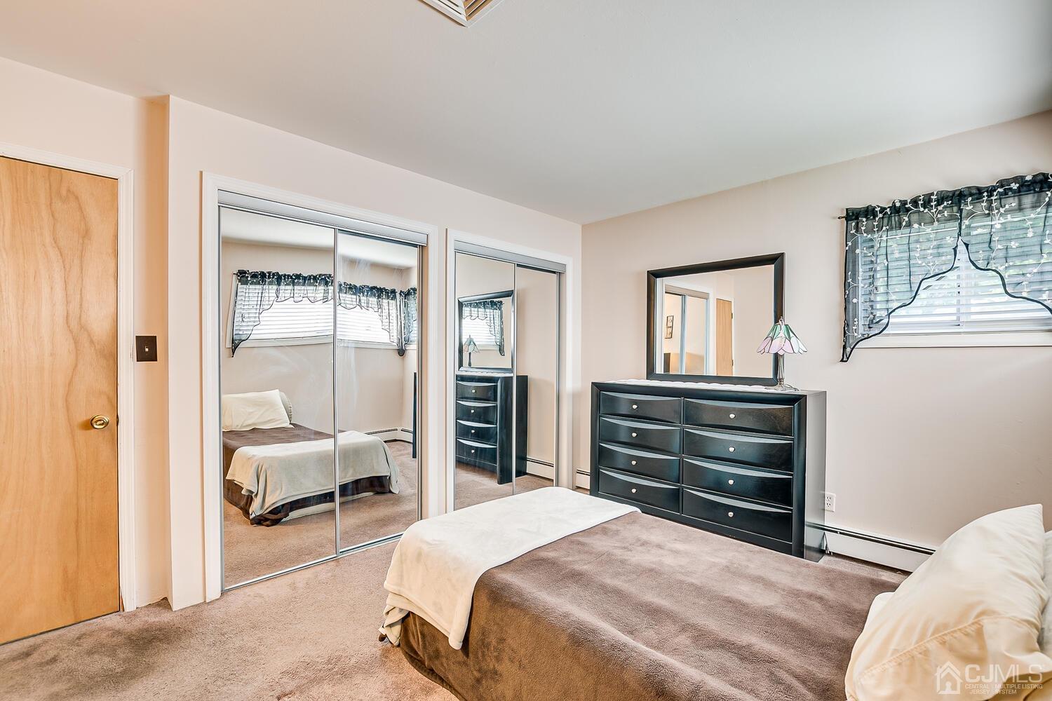 43 Kenmore Road Edison, NJ 08817 - Photo 11 of 19 a bedroom with a bed and a dresser