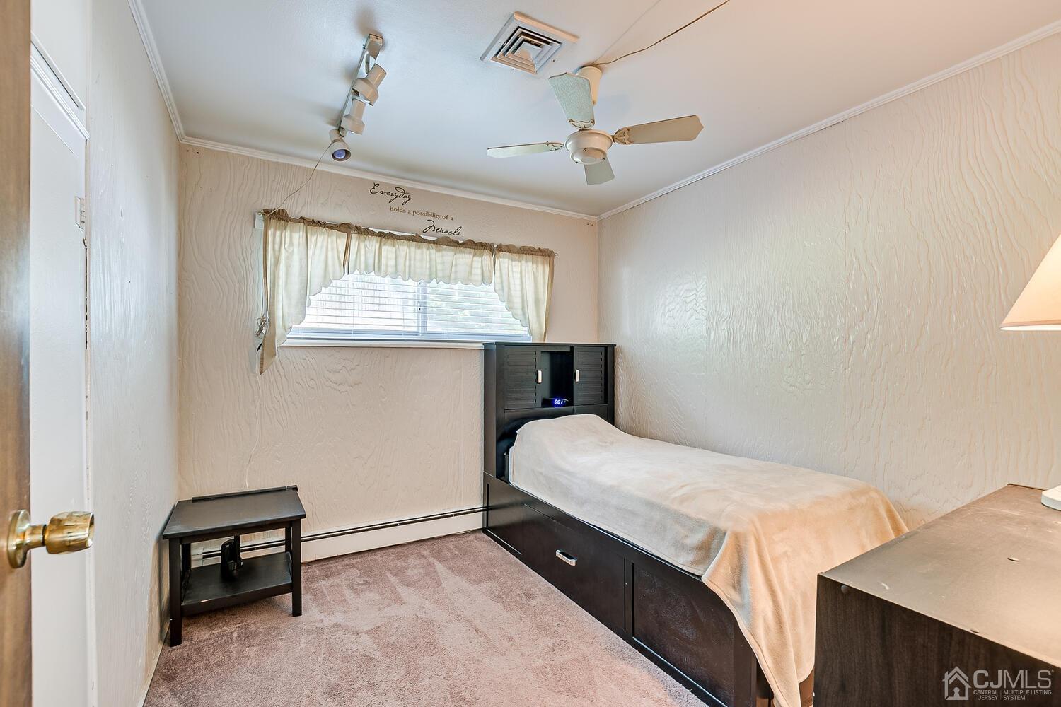43 Kenmore Road Edison, NJ 08817 - Photo 12 of 19 a bedroom with a bed and a window