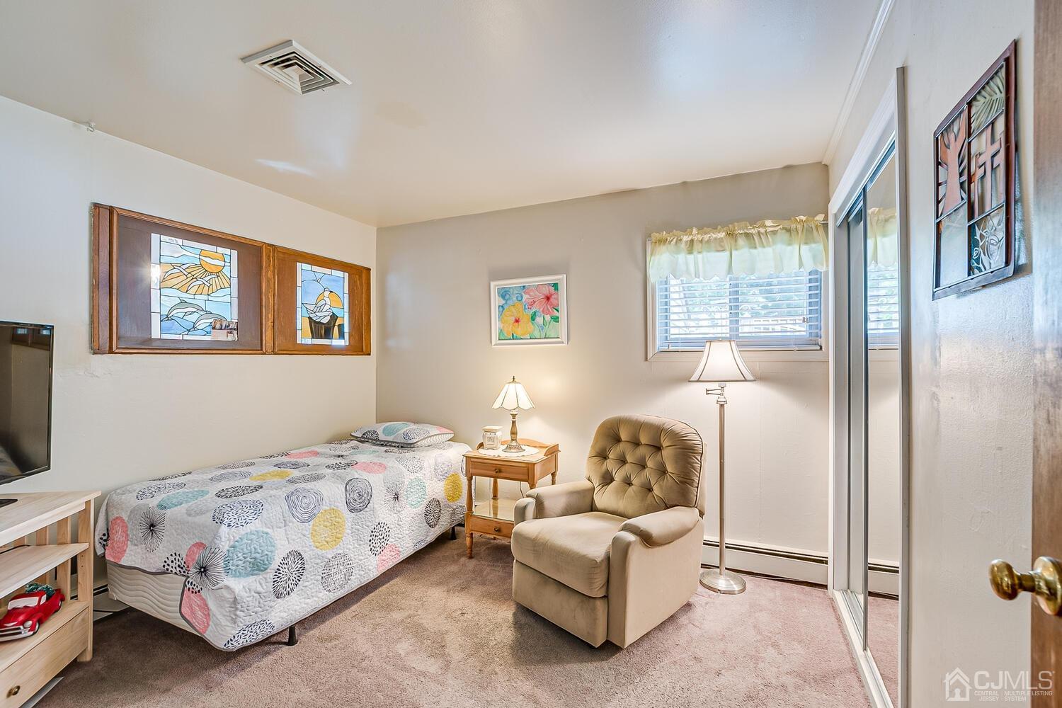 43 Kenmore Road Edison, NJ 08817 - Photo 13 of 19 a bedroom with a bed and a couch