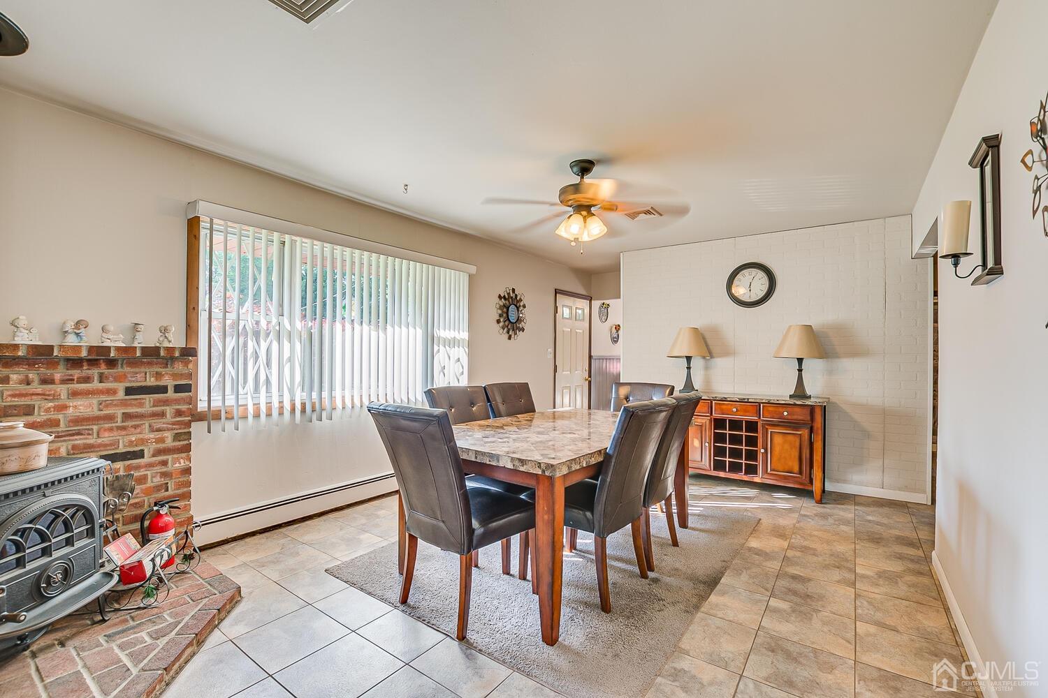 43 Kenmore Road Edison, NJ 08817 - Photo 3 of 19 a view of a dining room with furniture and chandelier
