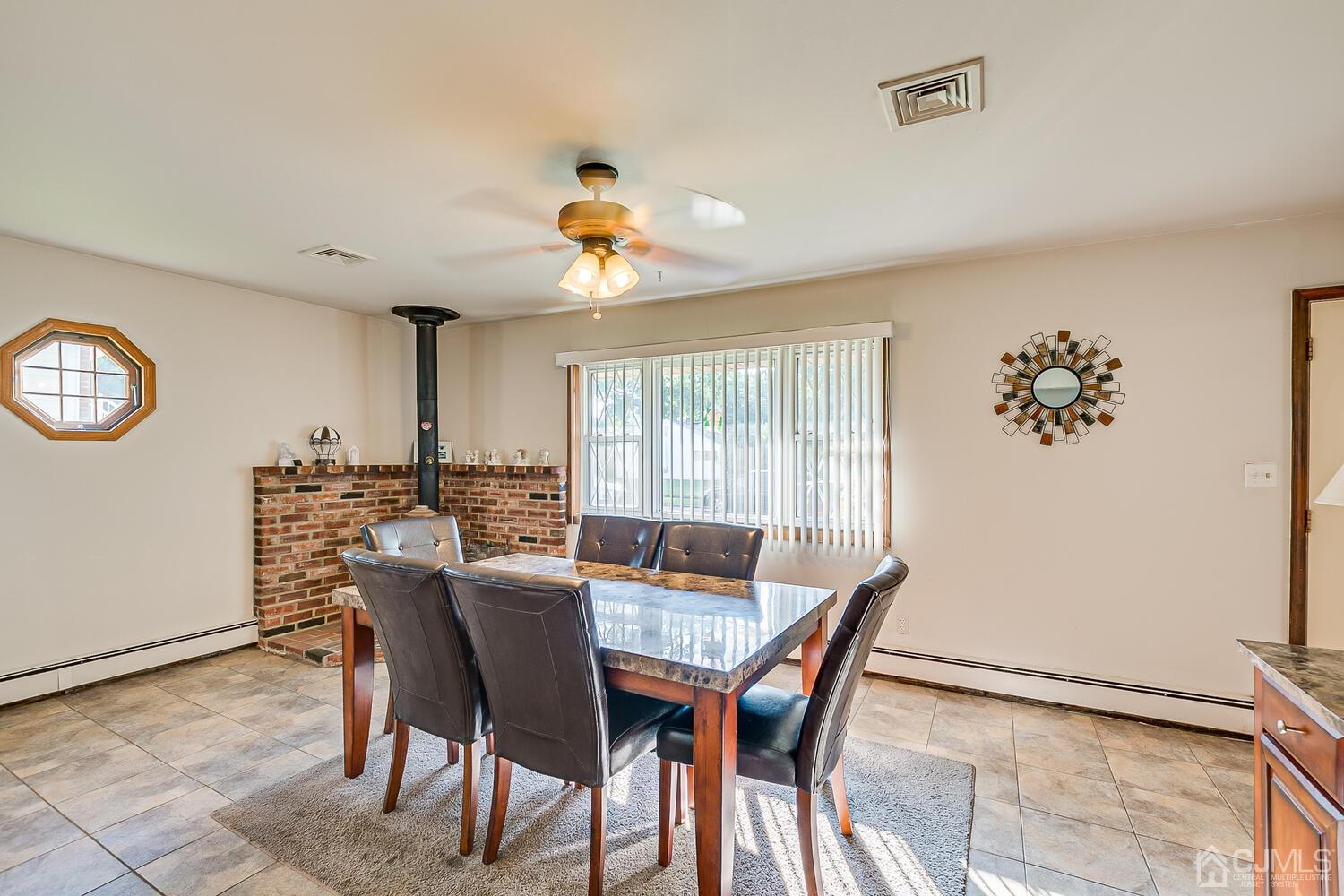 43 Kenmore Road Edison, NJ 08817 - Photo 4 of 19 a view of a dining room with furniture window and outside view