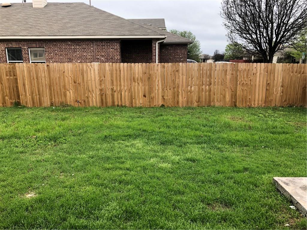 801 Ranchero Road Leander, TX 78641 - Photo 13 of 13 a view of backyard with wooden fence