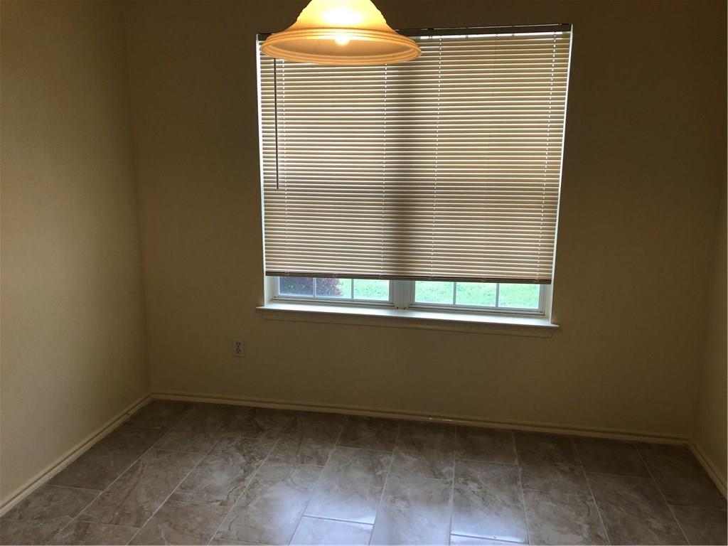 801 Ranchero Road Leander, TX 78641 - Photo 6 of 13 a view of an empty room with a window