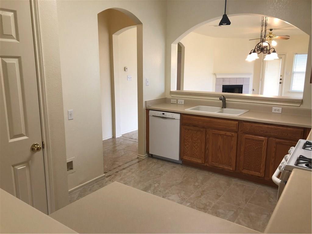 801 Ranchero Road Leander, TX 78641 - Photo 10 of 13 a spacious bathroom with a granite countertop sink a mirror and a vanity