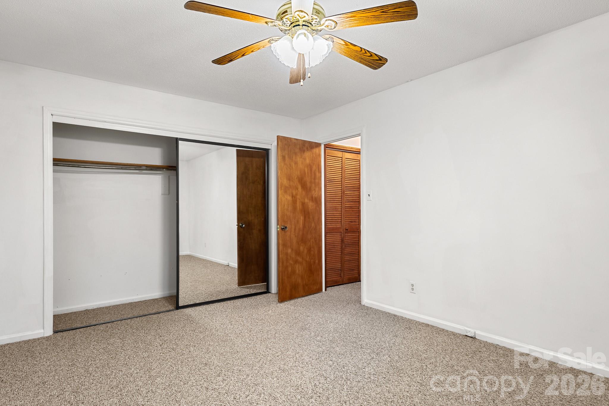 27077 Catamaran Drive Tega Cay, SC 29708 - Photo 16 of 28 an empty room with chandelier fan