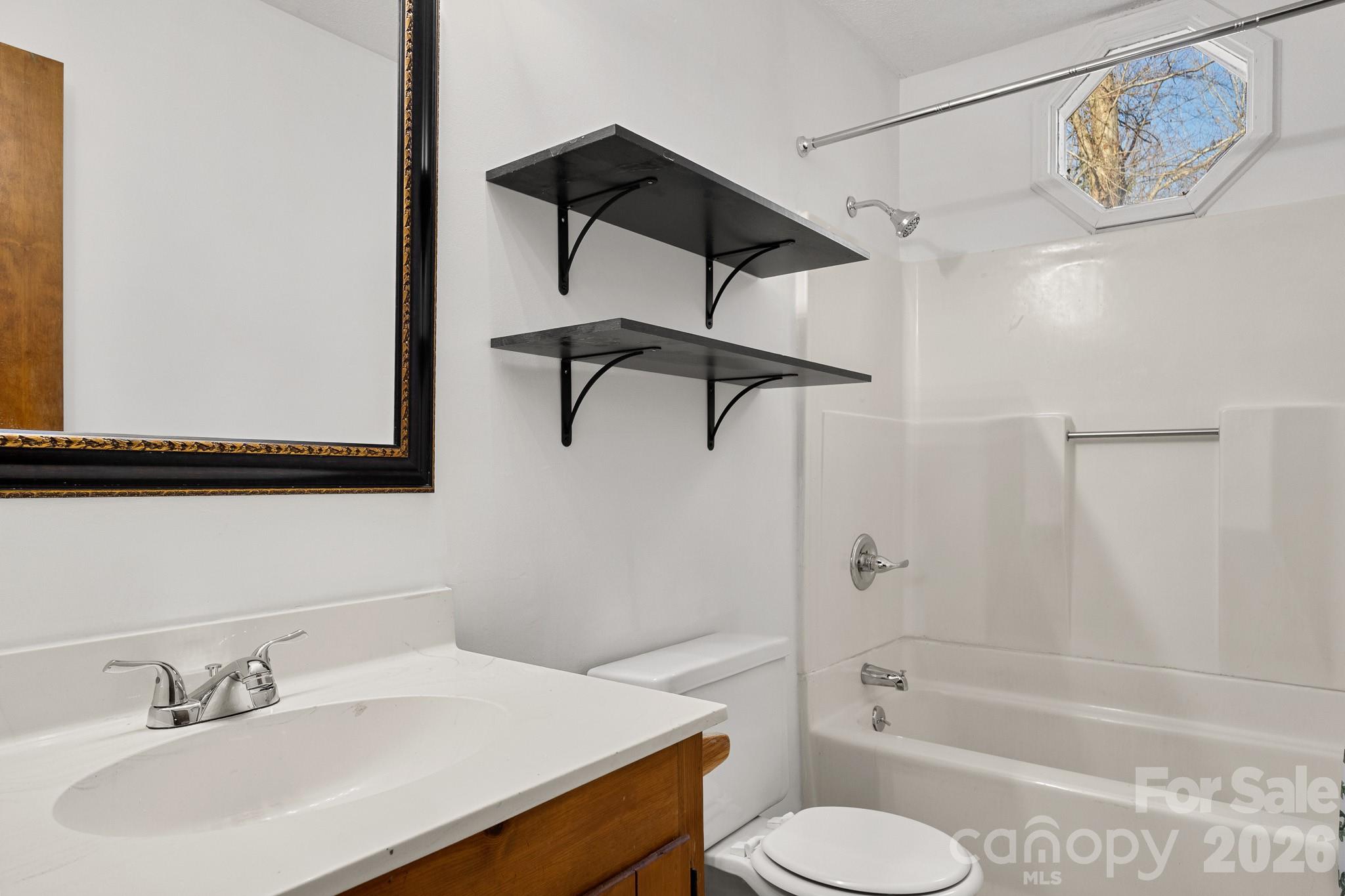 27077 Catamaran Drive Tega Cay, SC 29708 - Photo 17 of 28 a bathroom with a sink toilet and shower