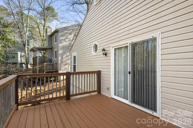a view of wooden balcony with wooden floor