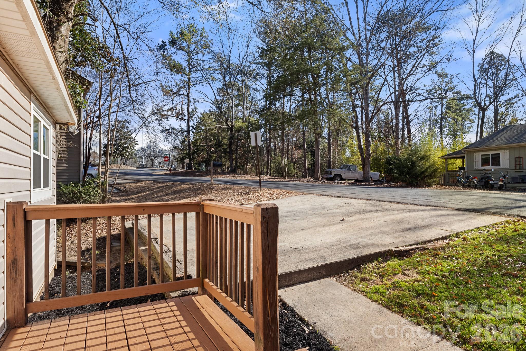 27077 Catamaran Drive Tega Cay, SC 29708 - Photo 3 of 28 a view of a street with wooden fence