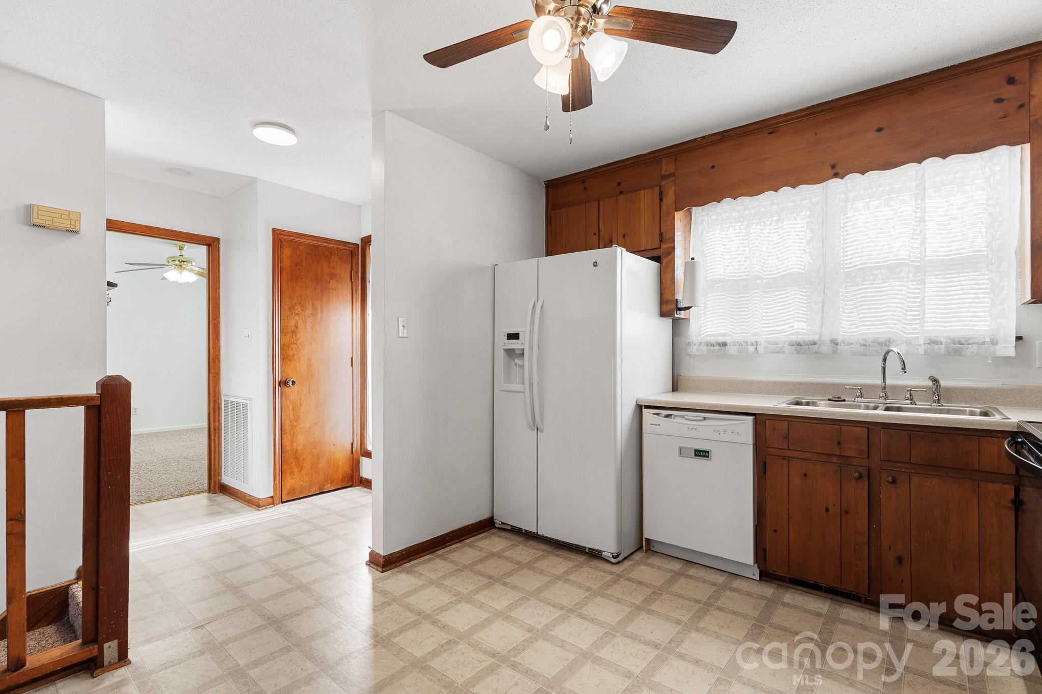 27077 Catamaran Drive Tega Cay, SC 29708 - Photo 9 of 28 a view of a kitchen with a sink and a window
