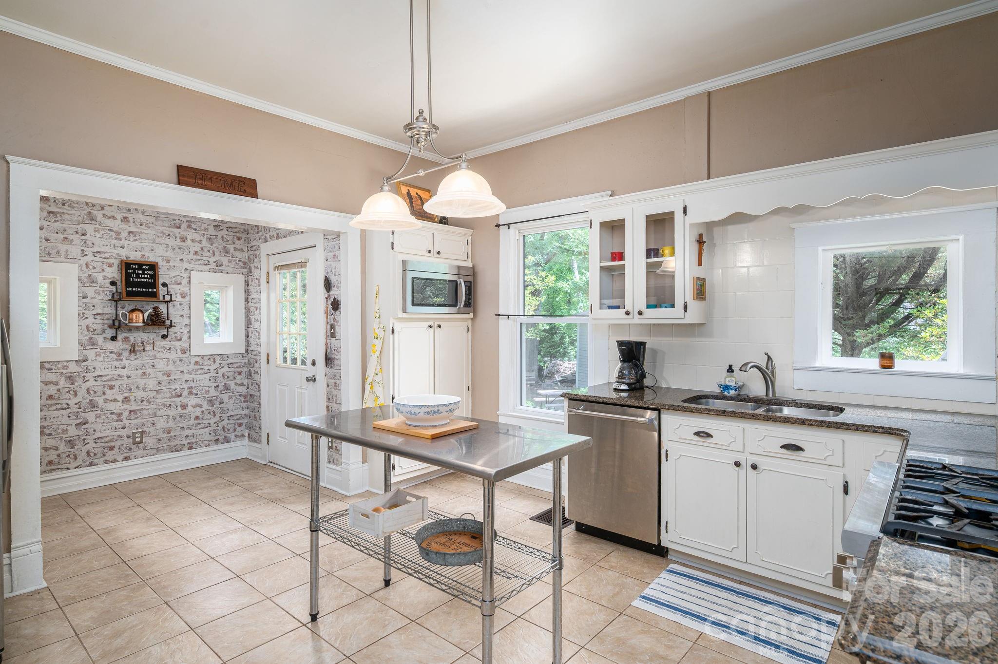 306 West Old Post Road Cherryville, NC 28021 - Photo 14 of 42 a kitchen with stainless steel appliances granite countertop a stove a sink dishwasher and a refrigerator with wooden floor