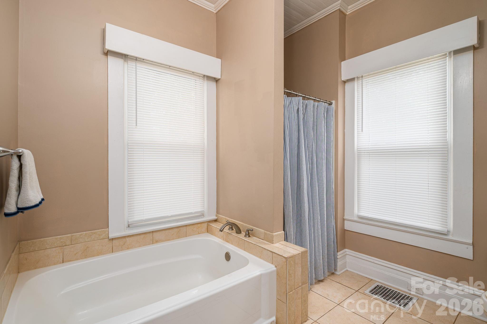 306 West Old Post Road Cherryville, NC 28021 - Photo 21 of 42 a white bath tub sitting next to a window