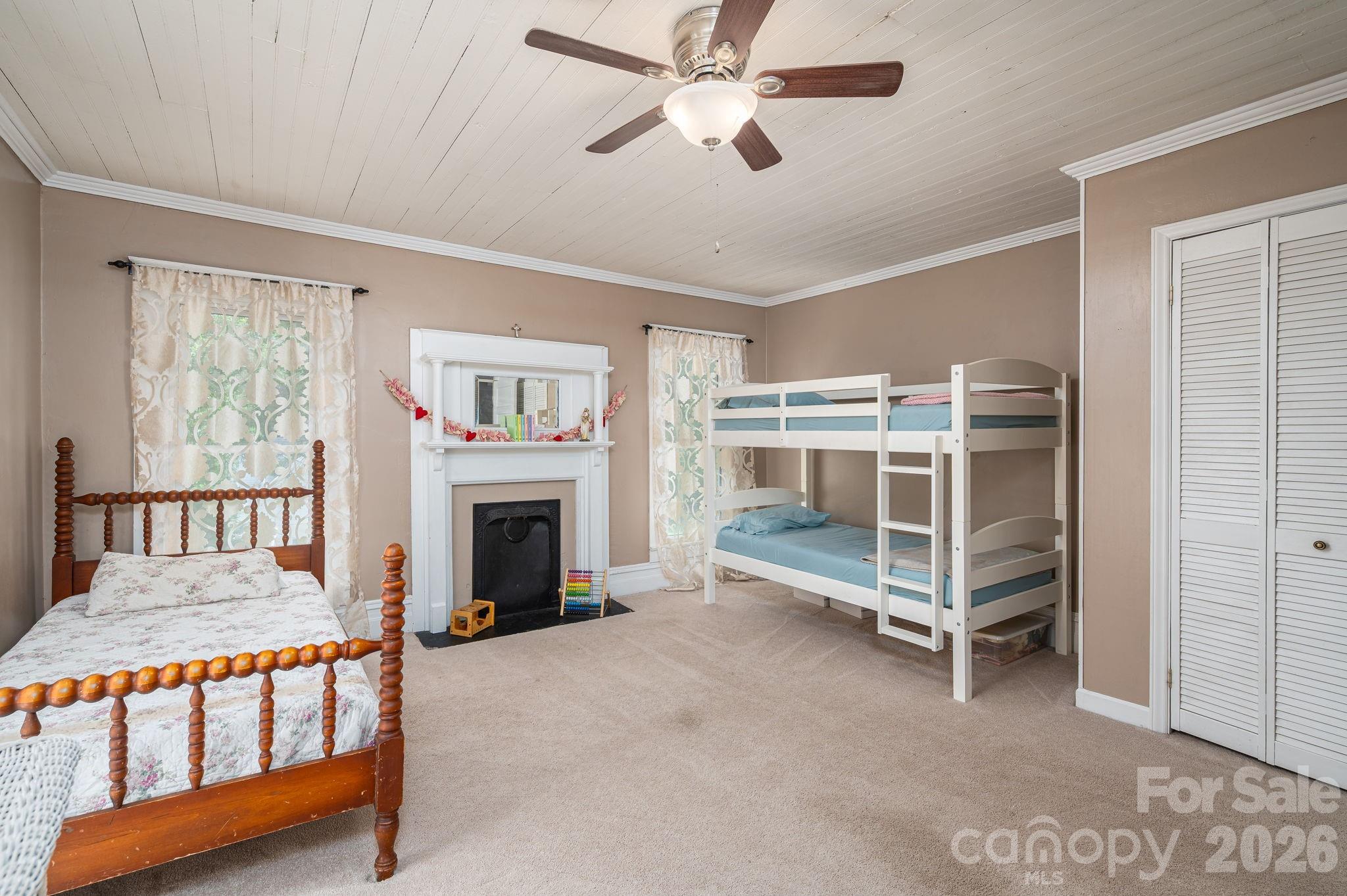 306 West Old Post Road Cherryville, NC 28021 - Photo 25 of 42 a living room with a bed furniture and a fireplace
