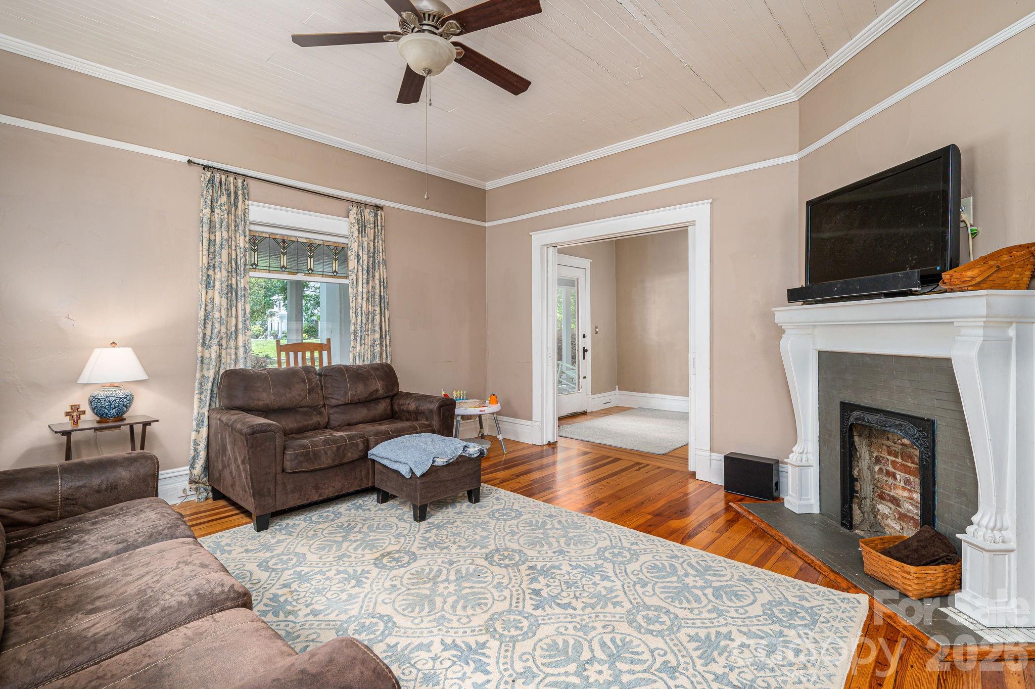306 West Old Post Road Cherryville, NC 28021 - Photo 8 of 42 a living room with furniture and a fireplace