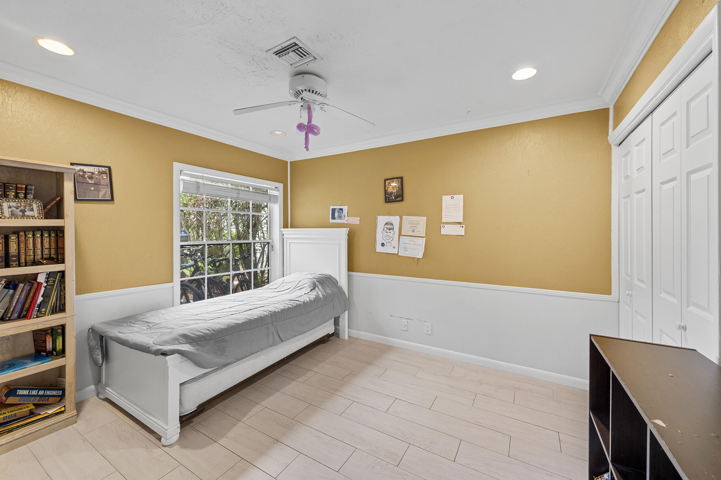 21089 Brookshire Terrace Boca Raton, FL 33433 - Photo 22 of 30 a spacious bedroom with a bed and a book shelf