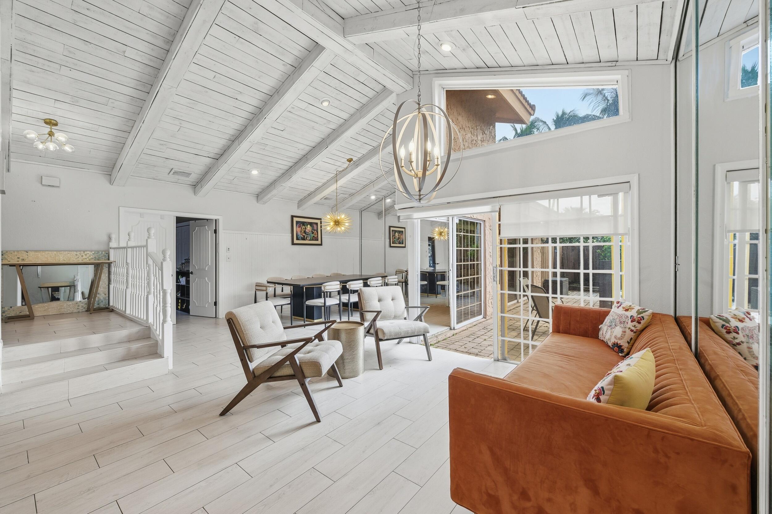 21089 Brookshire Terrace Boca Raton, FL 33433 - Photo 4 of 30 a living room with furniture and a large window