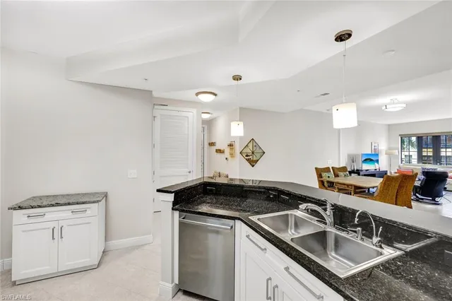 a kitchen that has a sink and a stove