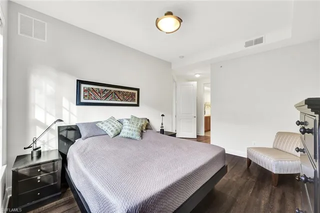 a bedroom with a bed and a couch