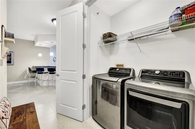 a view of a kitchen with a stove top oven and cabinets
