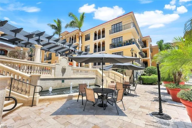 a view of a chairs and table in the patio