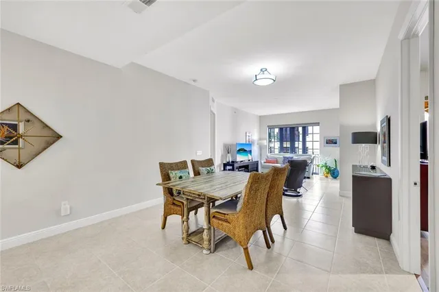a view of a dining room with furniture and a window