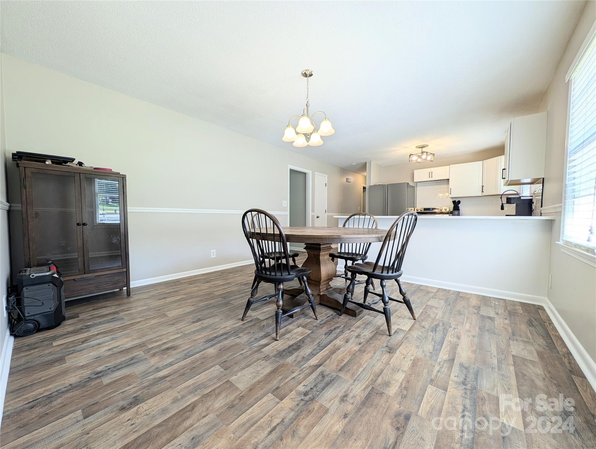 1285 Rainbow Circle Catawba, SC 29704 - Photo 12 of 23 a view of a dining room with furniture and wooden floor