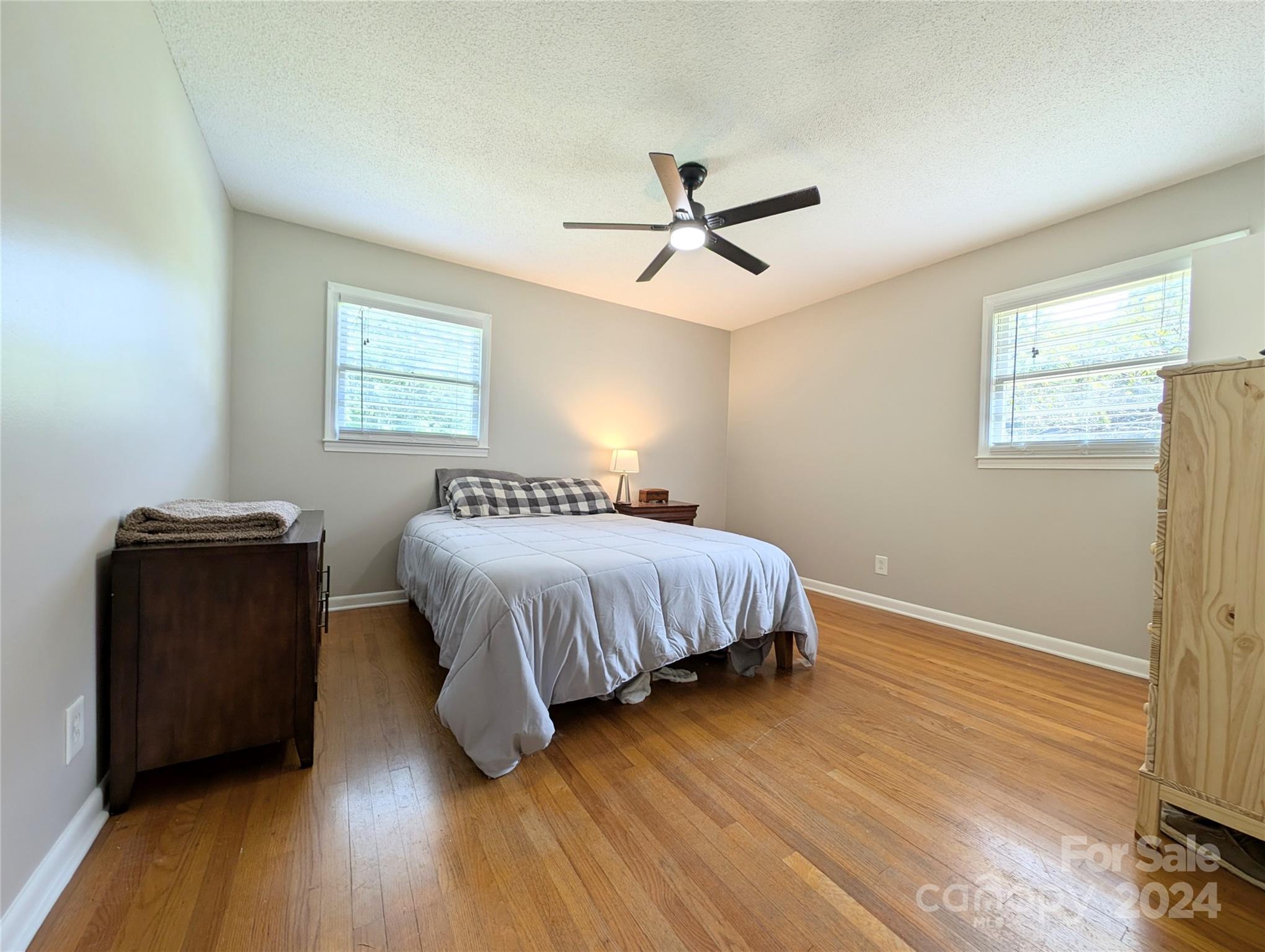 1285 Rainbow Circle Catawba, SC 29704 - Photo 19 of 23 a bedroom with a bed and wooden floor