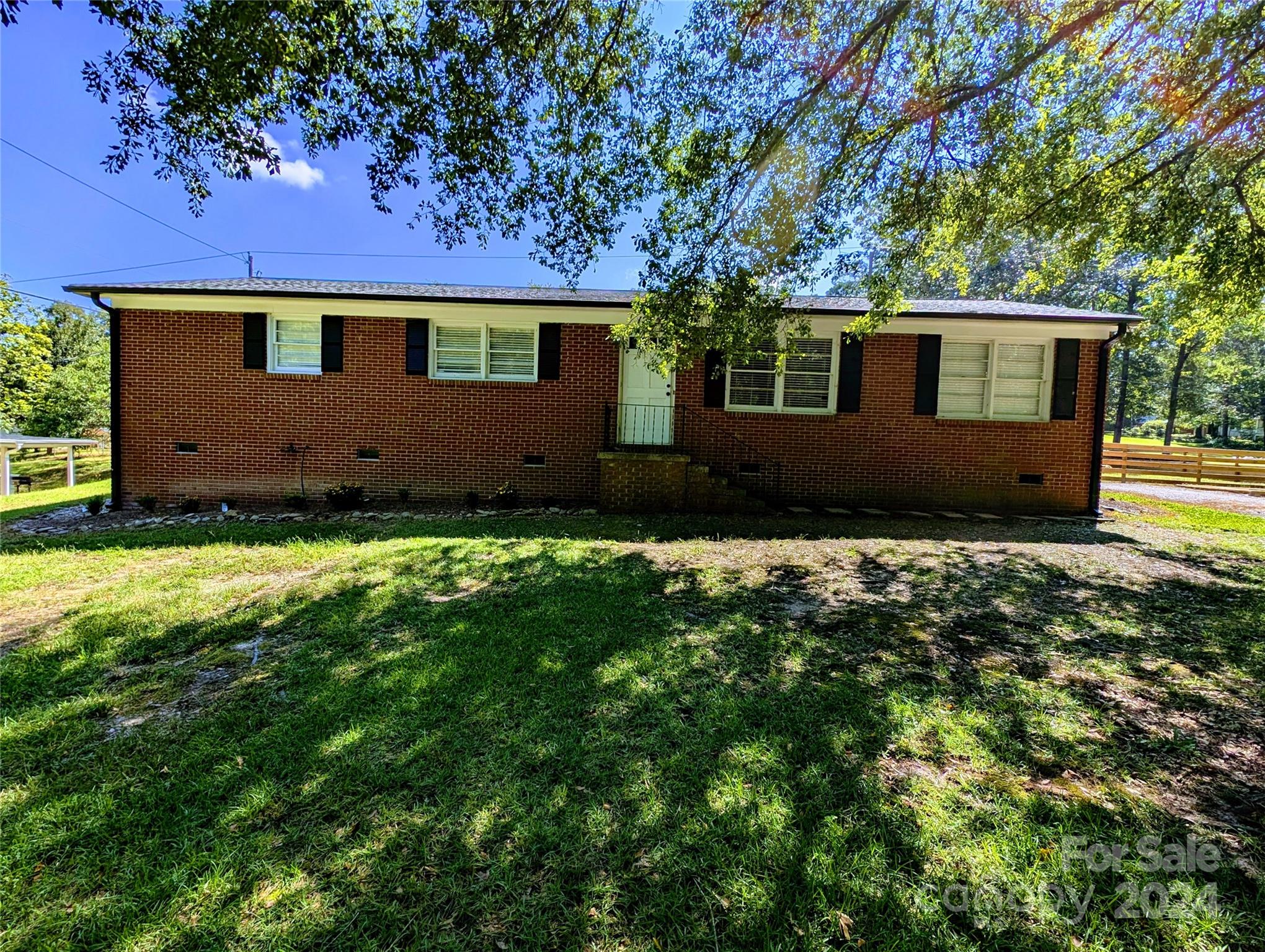 1285 Rainbow Circle Catawba, SC 29704 - Photo 2 of 23 a front view of a house with a garden