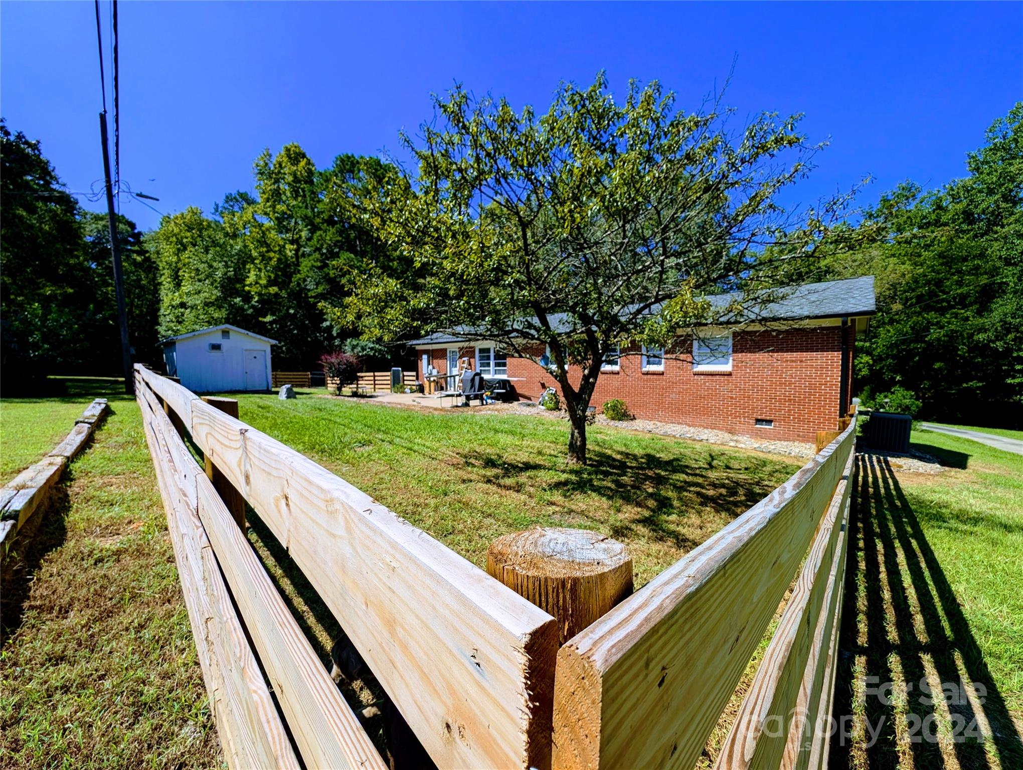 1285 Rainbow Circle Catawba, SC 29704 - Photo 3 of 23 a view of a backyard with wooden fence