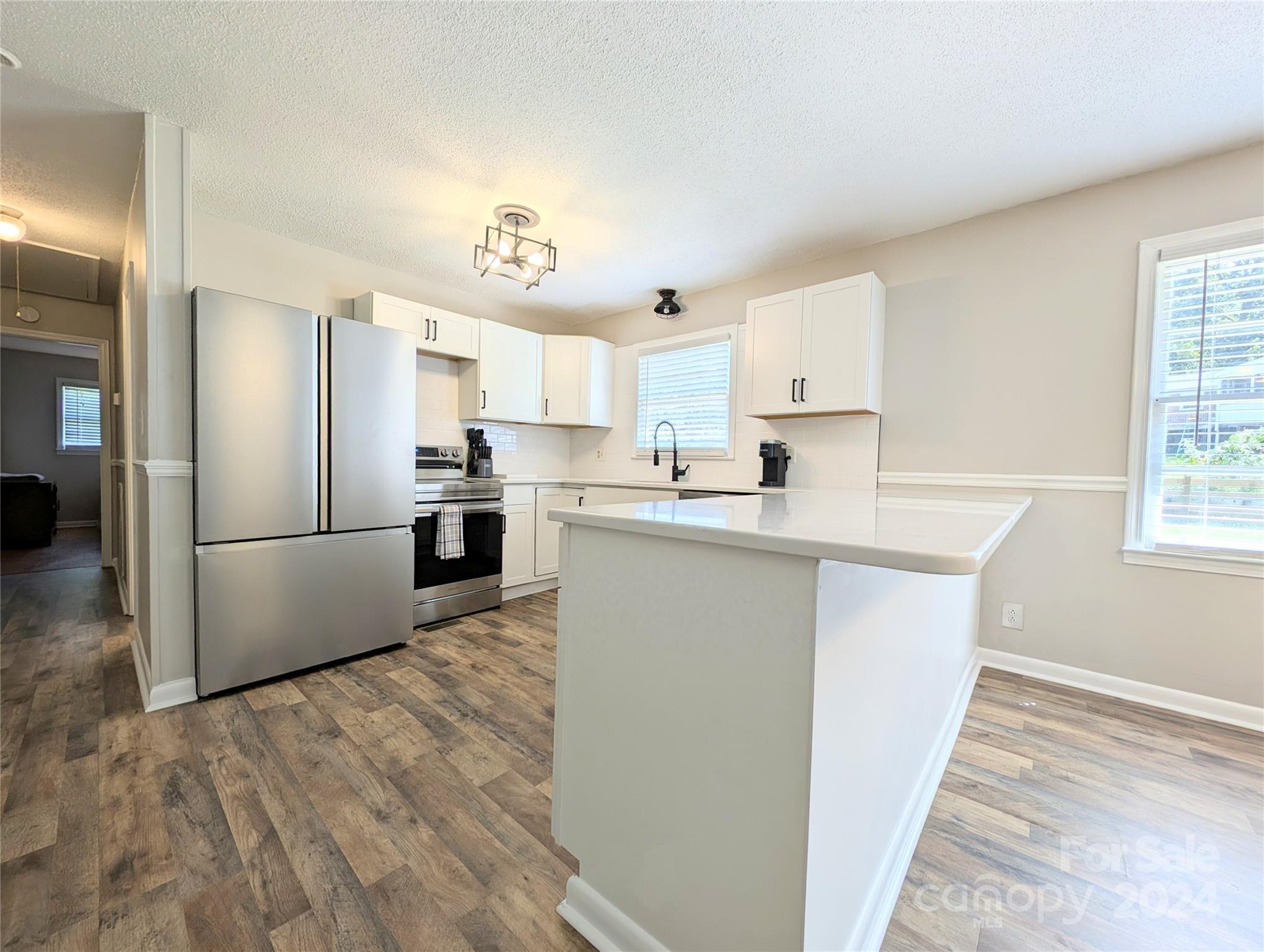 1285 Rainbow Circle Catawba, SC 29704 - Photo 8 of 23 a kitchen with stainless steel appliances a refrigerator sink and cabinets