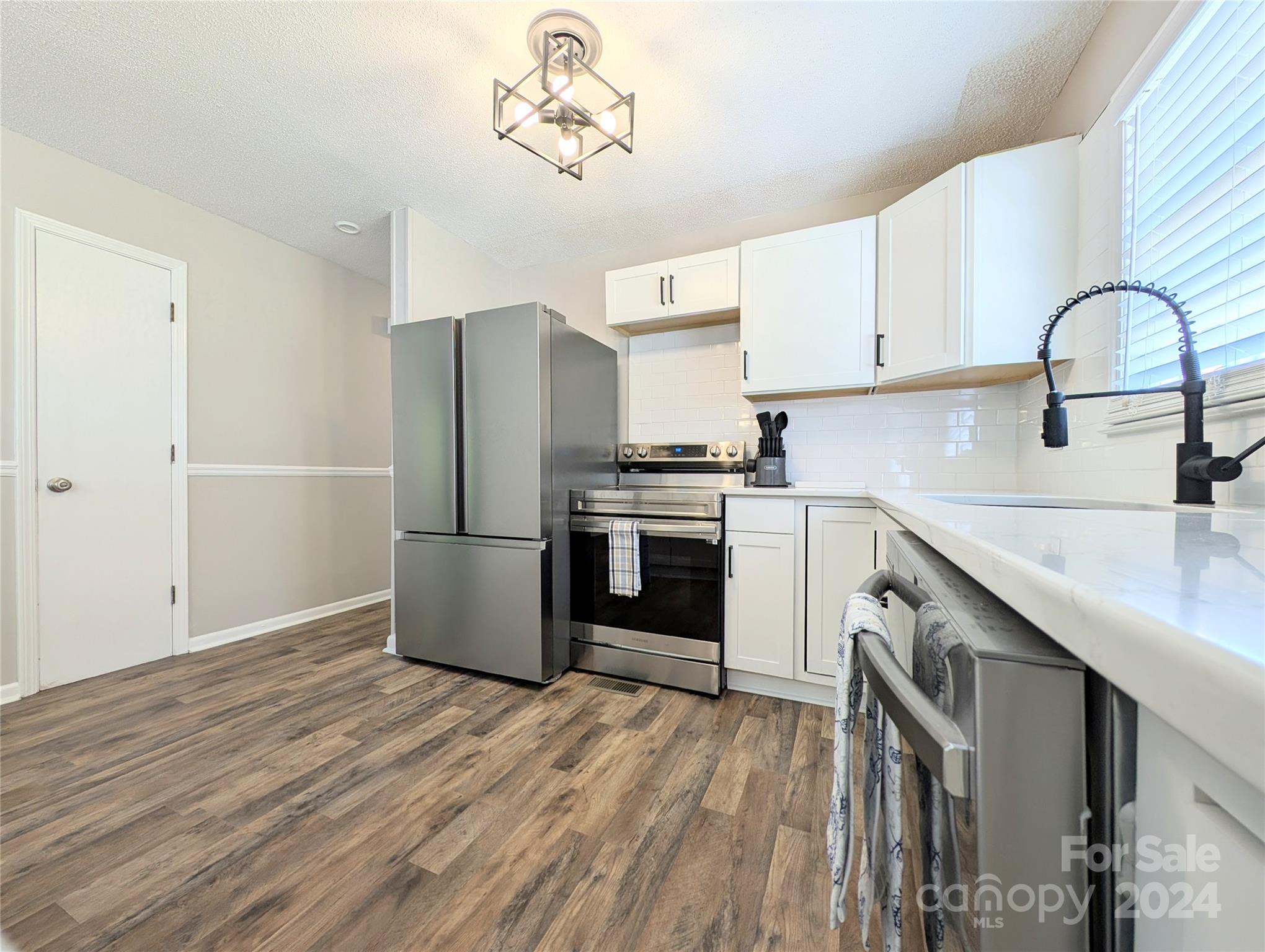 1285 Rainbow Circle Catawba, SC 29704 - Photo 10 of 23 a kitchen with a stove a sink and a refrigerator