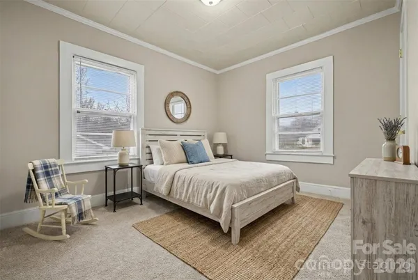 a bedroom with a bed and a table in it