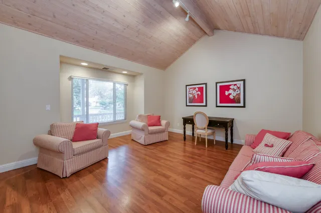 an empty room with closet and ceiling fan