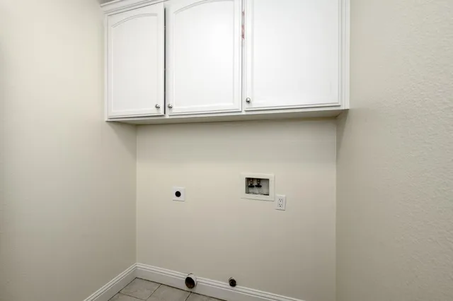 a front view of a house with a yard outdoor seating and garage