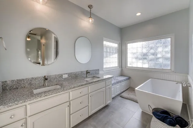 a view of a patio with table and chairs and potted plants