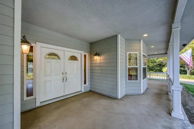 a view of a livingroom with furniture and hardwood floor